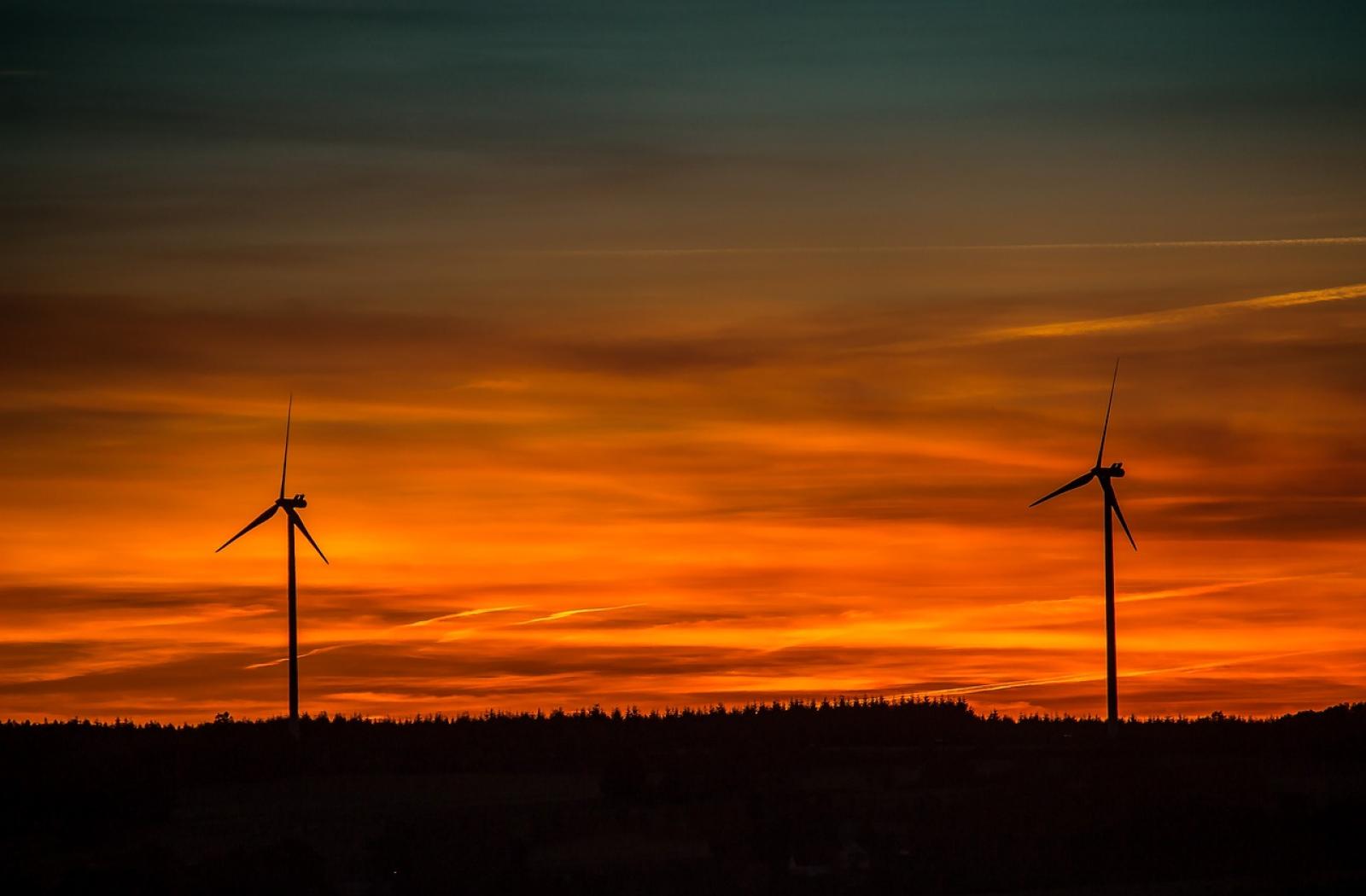 Windmills in the sunset on Commonwealth NDC Webinar event notice